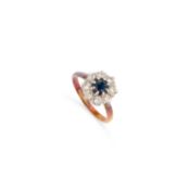 A SAPPHIRE AND DIAMOND CLUSTER RING