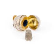 A VICTORIAN SILVER 'EGG' COMBINATION VINAIGRETTE THIMBLE CASE
