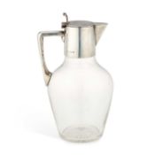 AN EDWARDIAN SILVER-MOUNTED GLASS CLARET JUG