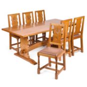 COXWOLD CABINET MAKERS, A UNICORNMAN OAK DINING SUITE