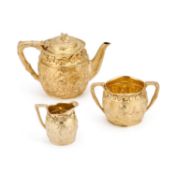 A FINE VICTORIAN SILVER-GILT THREE-PIECE TEA SERVICE