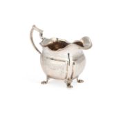A GEORGE III IRISH SILVER CREAM JUG
