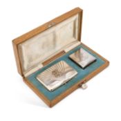 AN EARLY 20TH CENTURY RUSSIAN SILVER SMOKING SET