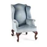 A LARGE IRISH MAHOGANY AND UPHOLSTERED COUNTRY HOUSE WING-BACK ARMCHAIR 19TH CENTURY