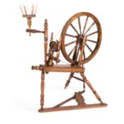 A STAINED BEECH SPINNING WHEEL 20TH CENTURY