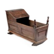 AN 18TH CENTURY OAK CRADLE