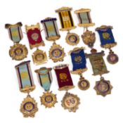 A COLLECTION OF NINE ROYAL ANTEDILUVIAN ORDER OF BUFFALOES SILVER AND ENAMEL JEWELS