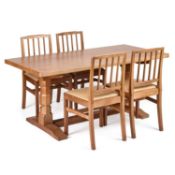 DEREK SLATER OF CRAYKE, A LIZARDMAN OAK DINING TABLE AND FOUR CHAIRS