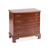A SMALL REGENCY STYLE MAHOGANY BOW-FRONT CHEST OF DRAWERS