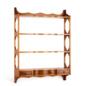 A GEORGIAN STYLE YEW WOOD HANGING WALL-SHELF