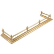 AN EDWARDIAN BRASS FENDER