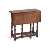 AN EARLY 18TH CENTURY WALNUT SINGLE-FLAP GATELEG TABLE