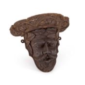 A 19TH CENTURY CARVED OAK WALL BRACKET