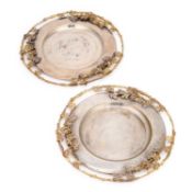 A PAIR OF ITALIAN PARCEL-GILT SILVER-PLATED SERVING PLATES