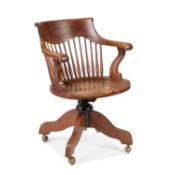 AN EARLY 20TH CENTURY OAK DESK CHAIR LABEL OF JAMES SHOOLBRED