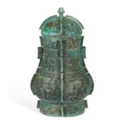A LARGE CHINESE BRONZE VESSEL IN ARCHAIC STYLE