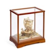A JAPANESE PARCEL-GILT SILVER MODEL OF A SINGLE-MASTED TREASURE SHIP