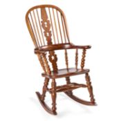 AN OAK AND ELM BROADARM WINDSOR ROCKING CHAIR