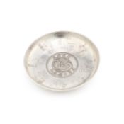 A CHINESE 'DRAGON DOLLAR' SILVER DISH