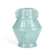 A CHINESE CELADON-GLAZED TWO-HANDLED VASE