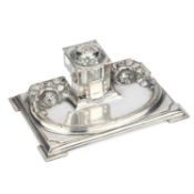 A SILVER-PLATED INKWELL CIRCA 1910