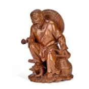 A CHINESE CARVED WOOD FIGURE