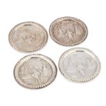 A SET OF FOUR DUTCH SILVER COASTERS