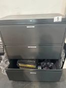 Three drawer lateral file with glasses, glass cases, etc