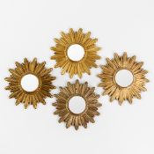 Four mid-century sunburst mirrors, convex glass. Circa 1970.