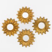 Four mid-century sunburst mirrors, convex glass. Circa 1970.