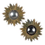 Deknudt, A pair of mid-century sunburst mirrors, convex glass. Gilt resin. Circa 1970.