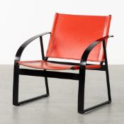 A High-Quality Armchair, Black Lacquered Metal and Red Leather.