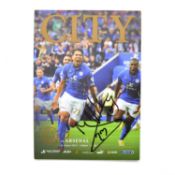 Leicester City vs Arsenal matchday programme, cover signed by Leonardo Ulloa
