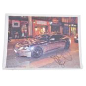 Signed Jermaine Pennant A4 colour photograph, inside Aston Martin