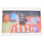 Signed Kenwyn Jones A4 colour photograph, Stoke City