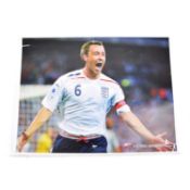 Signed John Terry A4 colour photograph, England, signature on back