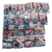 A collection of nineteen Star Wars figures in blister packs.