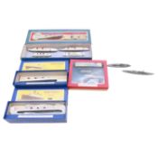 Sixteen Dinky waterline ship models