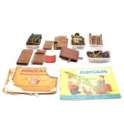 A box of loose Meccano, including no.1 clockwork motor, with Meccano catalogues and other magazines