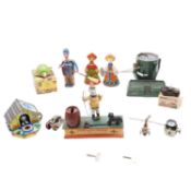 A collection of tinplate clockwork toys, money boxes and other vintage toys