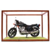 Scale model Honda CB750 , with detached left wing mirror and number plate, in perspecs display cabin