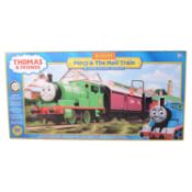 Hornby OO gauge Percy and The Mail Train set and two Trackmaster Tidmouth Sheds packs, and one other