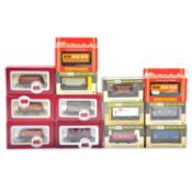 Thirteen OO gauge freight cars, including Dapol, Wrenn and Hornby, boxed