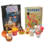 Star Wars Annual no. 1, Rupert Bear 1976 annual, and two boxes of McDonald's toys