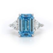 Emerald Cut 6.00 Carat Diamond Ring With Trilliant Diamonds Set In Platinum Fancy Blue - IGI Cert