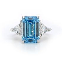 Emerald Cut 6.00 Carat Diamond Ring With Trilliant Diamonds Set In Platinum Fancy Blue - IGI Cert