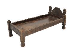 A carved hardwood prayer bed/table, North Pakistan, 19th century