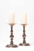 A pair of 17th century French pricket candlesticks