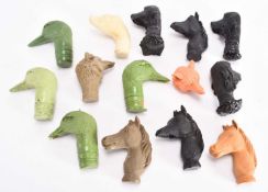 A collection of cast resin animal stick heads