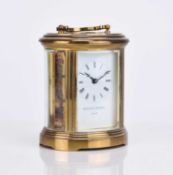 A Matthew Norman gilt brass carriage timepiece